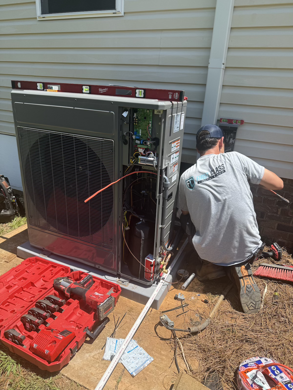 Cameron wiring a Rheem condenser unit with panel open