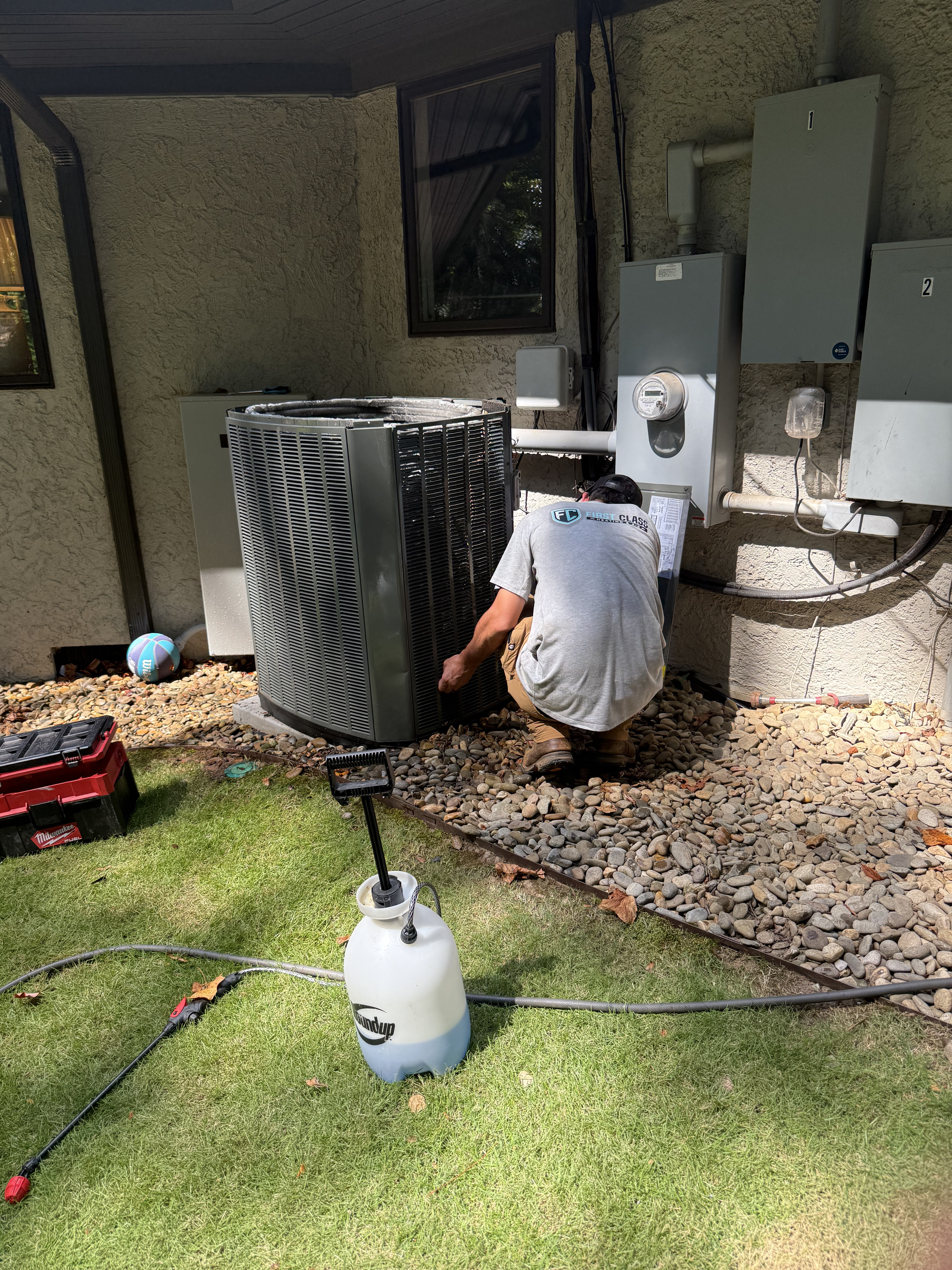 Cameron performing HVAC maintenance