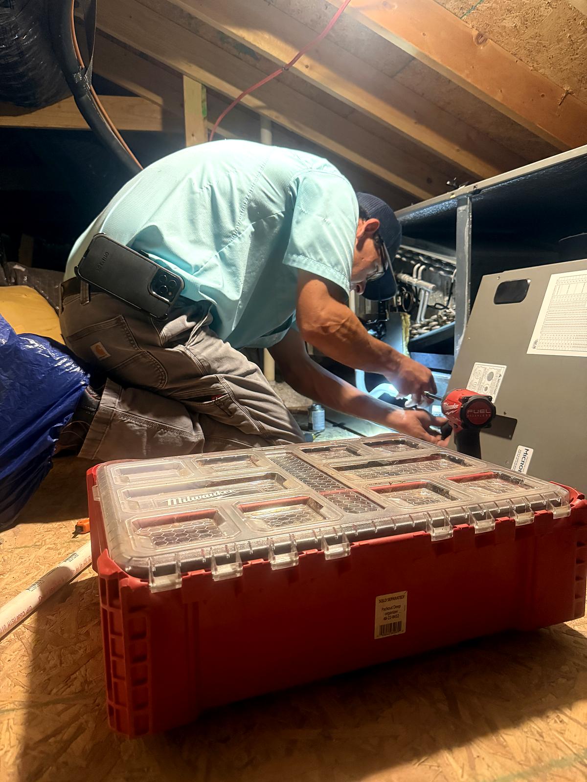 First Class technician repairing a clogged condensate drain line in Greenville, SC