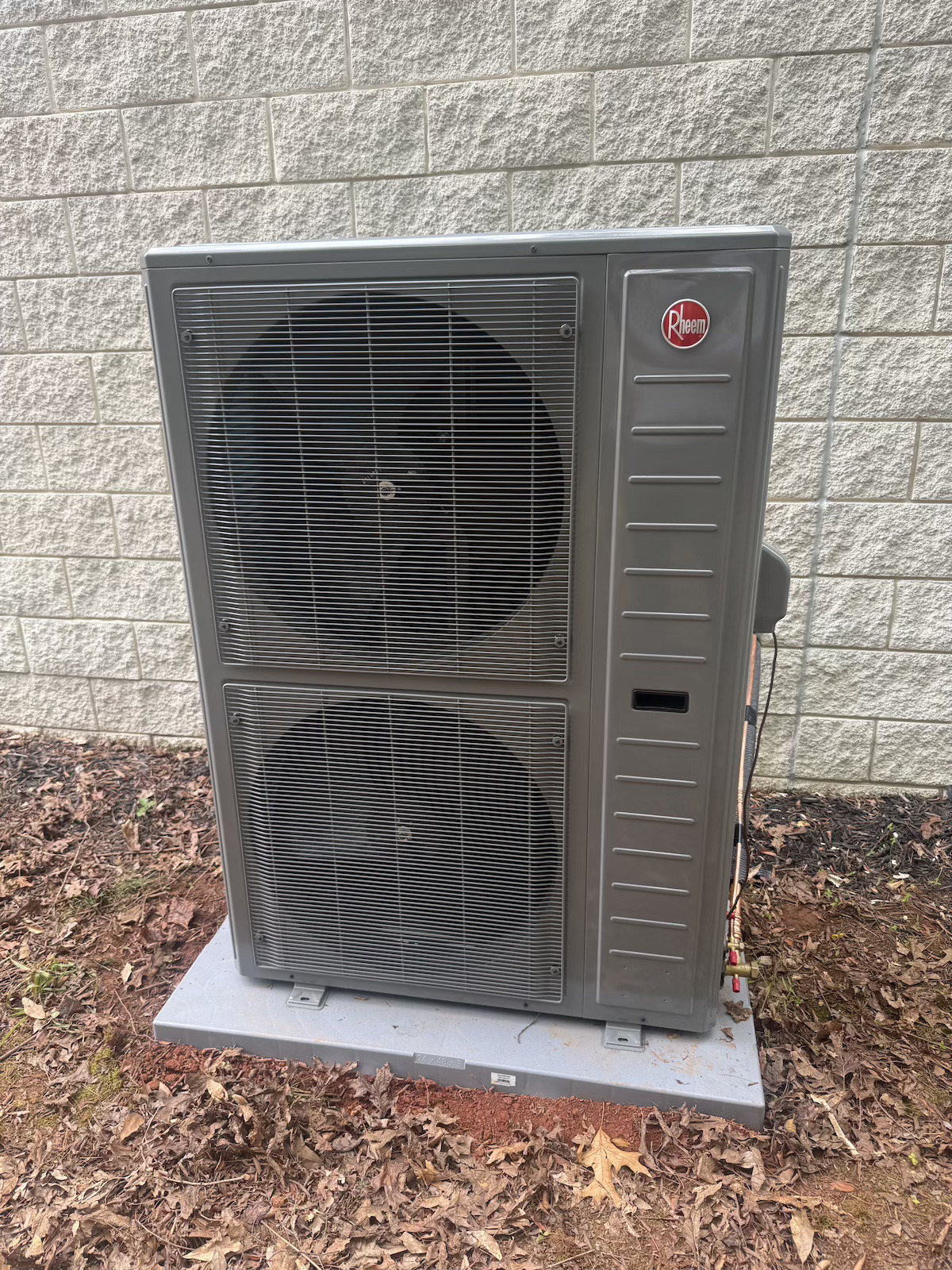 Rheem commercial heat pump condenser on equipment pad