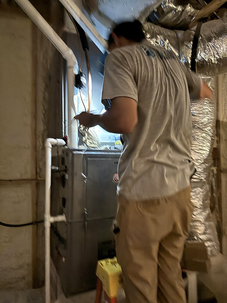 First Class Heating & Air technician installing a gas furnace on Crescent Avenue in Greenville, SC